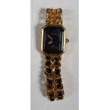 A Chanel quartz gilt metal lady's bracelet wristwatch, the signed black dial with gilt plain