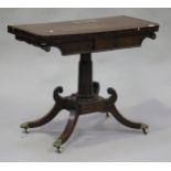 A Regency mahogany fold-over card table with crossbanded and beaded decoration, raised on a turned