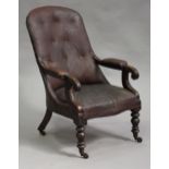 A Victorian mahogany scroll arm library chair, upholstered in brown leatherette, on turned legs,