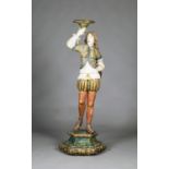 An early 20th century Italian carved wood and gesso figural torchère, modelled as a full-length