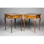 A pair of late Victorian walnut and floral marquetry envelope card tables, each revolving top