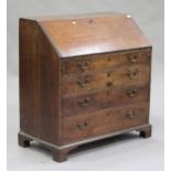 A George III oak bureau, the fall front above four long graduated drawers, on bracket feet, height