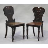 A Victorian mahogany hall chair with carved scroll decoration, together with a similar hall chair.