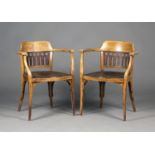 A pair of early 20th century stained beech and bent plywood armchairs, designed by Otto Wagner and