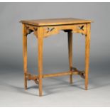 An Edwardian Arts and Crafts oak rectangular occasional table, bearing label marked 'Leslie