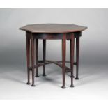 An Edwardian Arts and Crafts Glasgow School mahogany octagonal occasional table, the moulded top