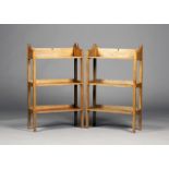 A pair of Edwardian Arts and Crafts oak three-tier open bookcases, the gallery backs pierced with