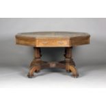 A late Victorian Aesthetic period walnut octagonal library table by Maple & Co, the moulded top