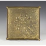 An early 20th century Arts and Crafts brass tray, engraved with stylized strapwork and a