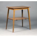 An Edwardian Arts and Crafts style oak occasional table, the rectangular top raised on square