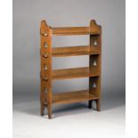 An Edwardian Arts and Crafts oak four-tier 'Sedley' bookcase by Liberty & Co, the pegged sides