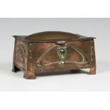 An Arts and Crafts copper box, possibly by Liberty & Co, the rectangular hinged lid above slightly