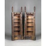 A pair of mid-19th century Gothic Revival painted pine narrow alcove bookcases of architectural