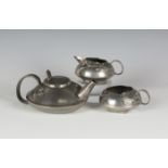 A Liberty & Co 'Tudric' pewter three-piece tea set, designed by Archibald Knox, model number '0231',