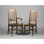 A set of five Edwardian Arts and Crafts Glasgow School oak framed dining chairs, possibly designed