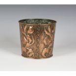 An early 20th century Arts and Crafts copper jardinière of tapering cylindrical form, the body