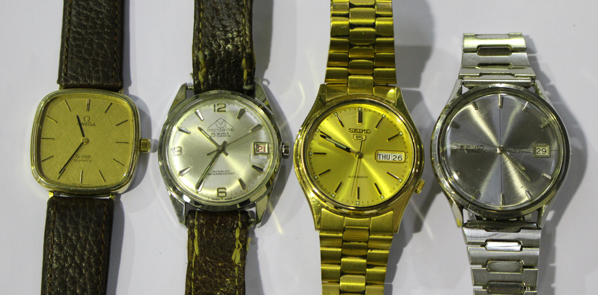 An Omega De Ville Quartz gilt metal fronted and steel backed gentleman's wristwatch, a Seiko 5