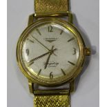 A Longines Flagship Automatic 18ct gold circular cased gentleman's wristwatch, the signed silvered