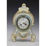 A late 19th century French pottery cased mantel clock with eight day movement striking on a gong,