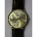 A Longines 9ct gold circular cased gentleman's wristwatch, the signed silvered dial with gilt