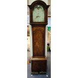 An early 19th century mahogany longcase clock with eight day movement striking on a bell, the 12-