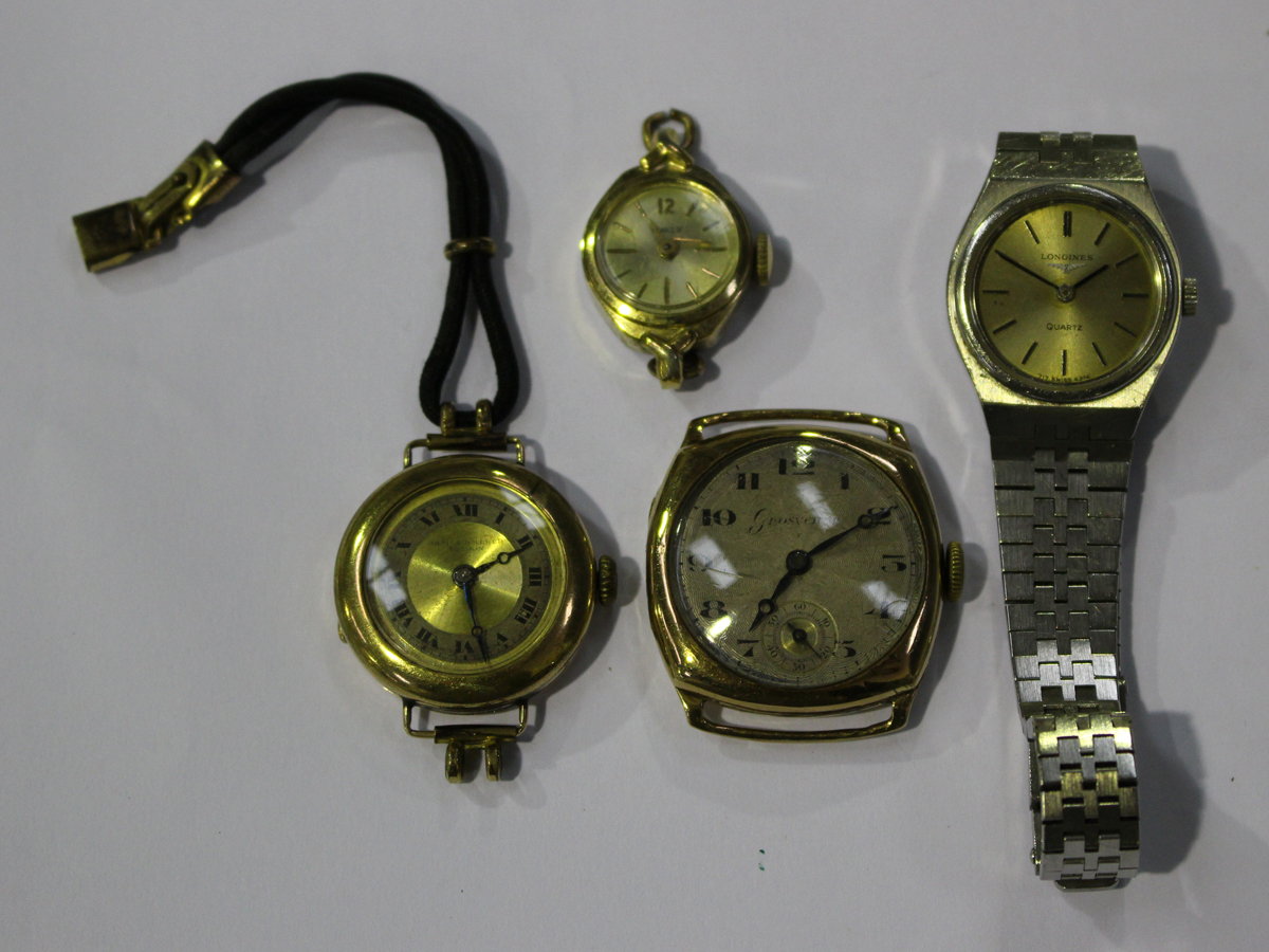 A 9ct gold circular cased lady's wristwatch, London 1922, a Grosvenor 9ct gold cushion shape cased