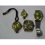 A 9ct gold circular cased lady's wristwatch, London 1922, a Grosvenor 9ct gold cushion shape cased