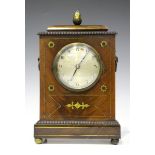 A Regency mahogany and brass inlaid mantel timepiece, the brass movement with platform escapement,