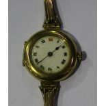 A 9ct gold circular cased lady's wristwatch, the jewelled lever movement detailed 'Buren', the