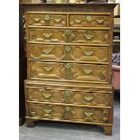 A 17th century oak chest-on-chest, the moulded pediment above two short and five long drawers, all