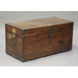 An early 20th century camphor travelling trunk with applied brass mounts and carrying handles,
