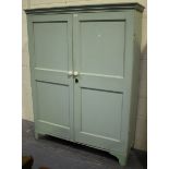 A Victorian blue painted cupboard, the moulded pediment above a pair of panel doors, on bracket