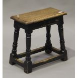 An early 20th century Jacobean Revival stained oak joint stool, raised on turned and block legs,