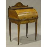 A late Victorian rosewood and foliate inlaid lady's cylinder bureau, the fall front enclosing a