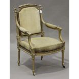 An early 20th century Louis XVI style gilt framed fauteuil armchair with acanthus leaf decoration,