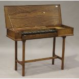 An Arnold Dolmetsch walnut cased clavichord, circa 1936, the interior with impressed maker's stamp