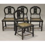 A set of four late 19th century ebonized and carved chinoiserie side chairs, the backs decorated