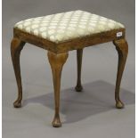 An early 20th century stained beech stool, the seat upholstered in a spotty cut velour, raised on