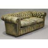 A modern buttoned olive green leather Chesterfield settee, height 72cm, length 200cm.Buyer’s Premium