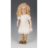 An S.F.B.J. bisque head character doll, impressed '238', with blonde wig, fixed brown glass eyes,