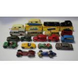 A small collection of Dinky Toys cars and commercial vehicles, including a No. 283 B.O.A.C. Coach, a