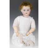 A Simon & Halbig K&R bisque head doll, impressed '80', with brown wig, pierced ears, sleeping blue