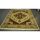 A modern machine made Persian style rug, the cream field with an angular medallion, within a