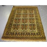 An Afghan rug, early/mid-20th century, the golden yellow field with an unusual design of