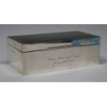 A George VI silver rectangular cigarette box, the hinged lid with engine turned decoration,