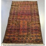 A Beluche prayer rug, Afghan/Persian borders, early 20th century, the shaded plum mihrab within a