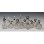 A group of thirteen silver mounted glass scent bottles, including a globular example with hobnail