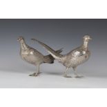 A pair of early 20th century German silver novelty boxes and covers in the form of a cock and hen