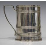A George III silver christening tankard of tapered cylindrical form with banded decoration and