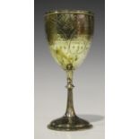 A Victorian silver goblet, the 'U' shaped body engraved with arched panels and pendant tassels above
